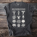 T-shirt with "Mushrooms An Illustrated Study of the Fungal World" and illustrations of various mushrooms.