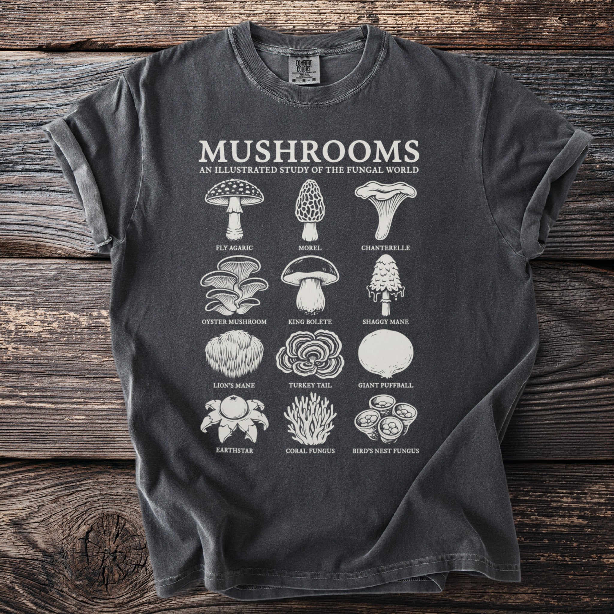 T-shirt with "Mushrooms An Illustrated Study of the Fungal World" and illustrations of various mushrooms.