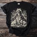 Black t-shirt with a cream graphic of a seated woman, two foxes, and celestial elements.