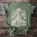 Olive green t-shirt with cream graphic of woman, two foxes, flowers, and moon phases.
