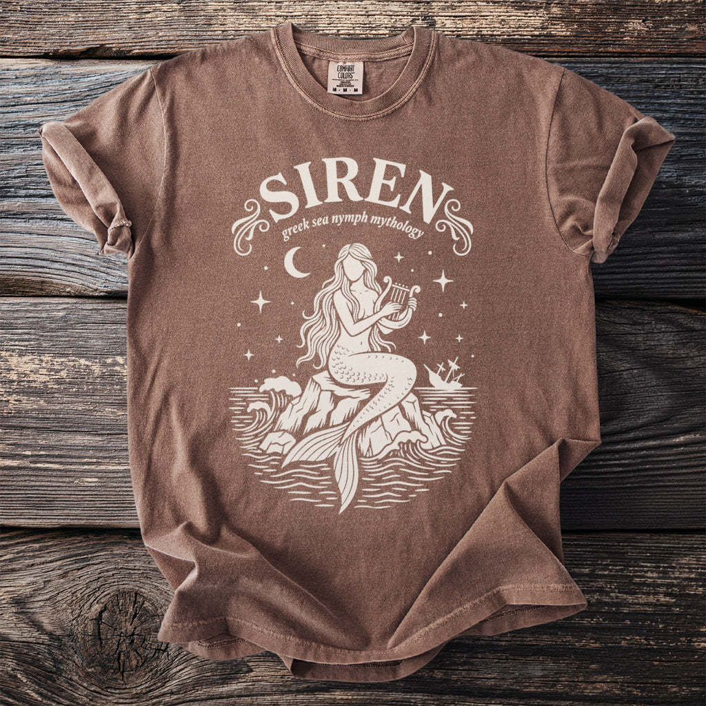 Shirt with ivory graphic of a siren playing a lyre on rocks, "Siren greek sea nymph mythology" text.
