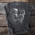 T-shirt with a drawing of a skeleton in a Santa hat holding a lantern and bats.