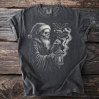 T-shirt with a drawing of a skeleton in a Santa hat holding a lantern and bats.