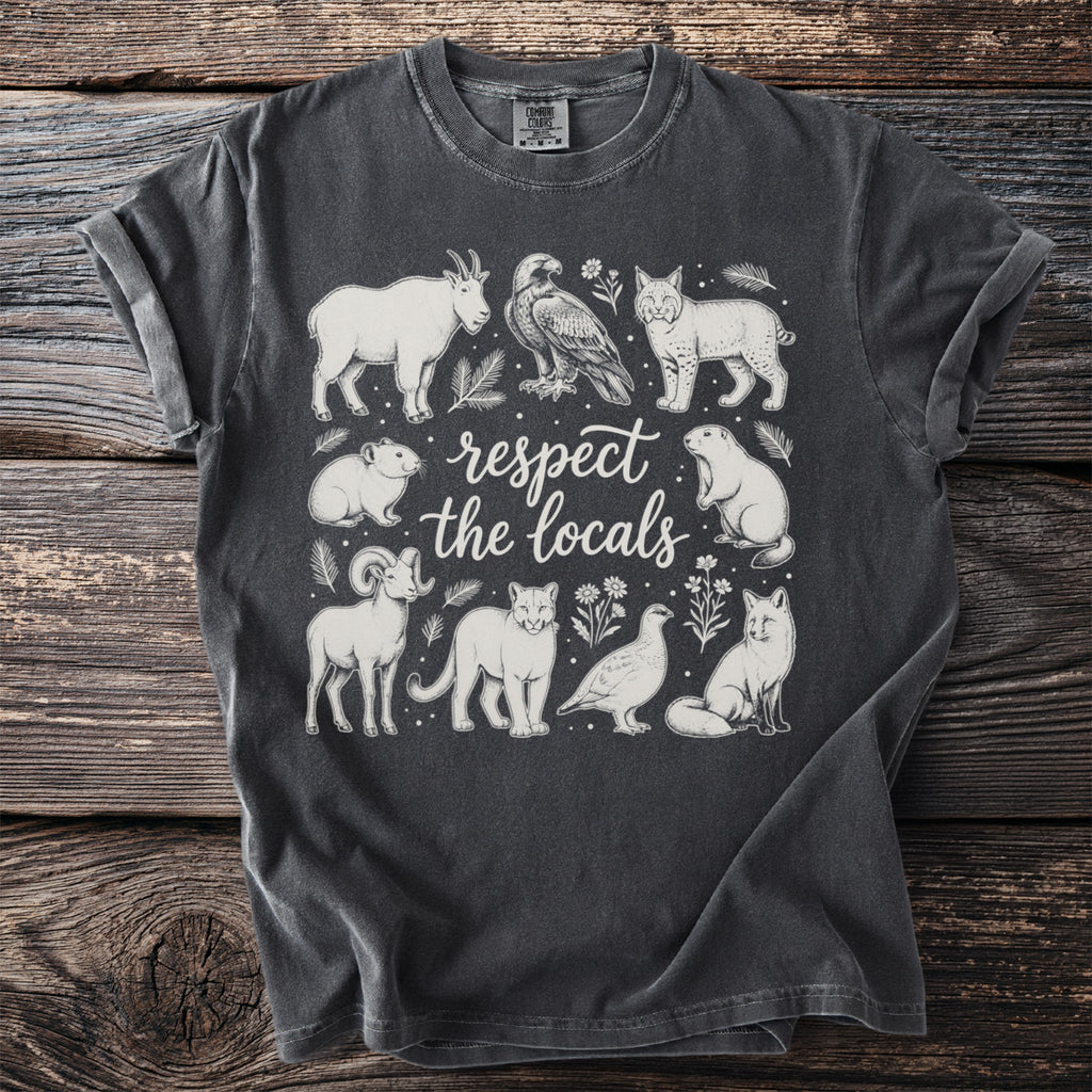 T-shirt with "Respect the Locals" text and mountain wildlife illustrations.