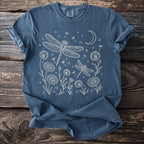 Dark blue t-shirt with line art of dragonflies, flowers, dandelions, and moon.