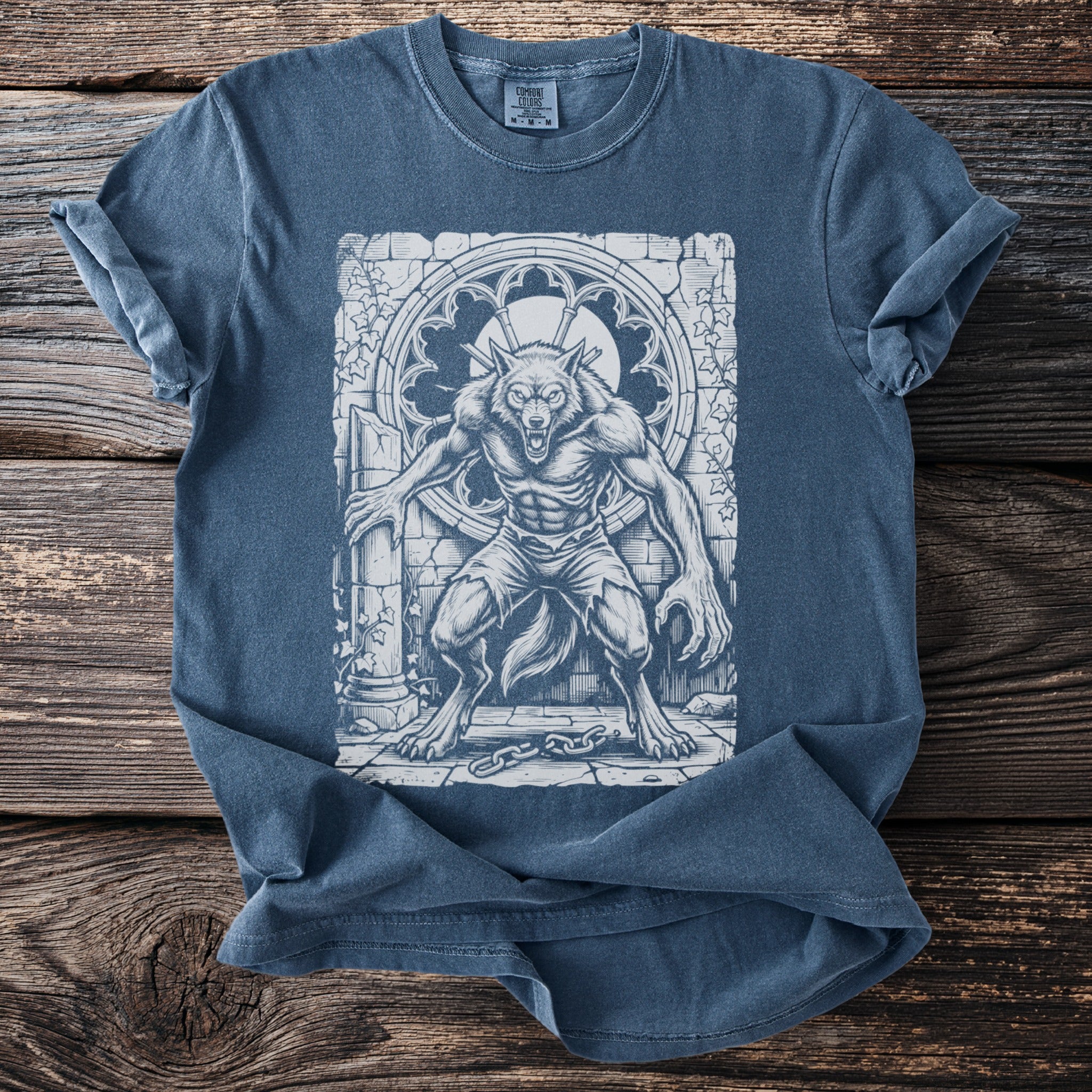 T-shirt with a sketch of a menacing werewolf in front of a gothic window.