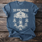 Blue t-shirt with graphic reading "The Nine Worlds" and depicting Yggdrasil with various realms.