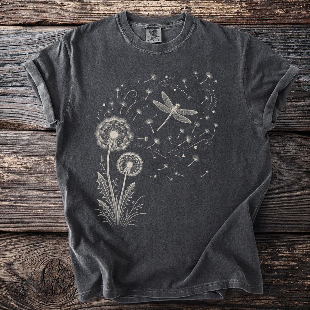 Dark grey t-shirt with white dragonfly and dandelion seed graphic.