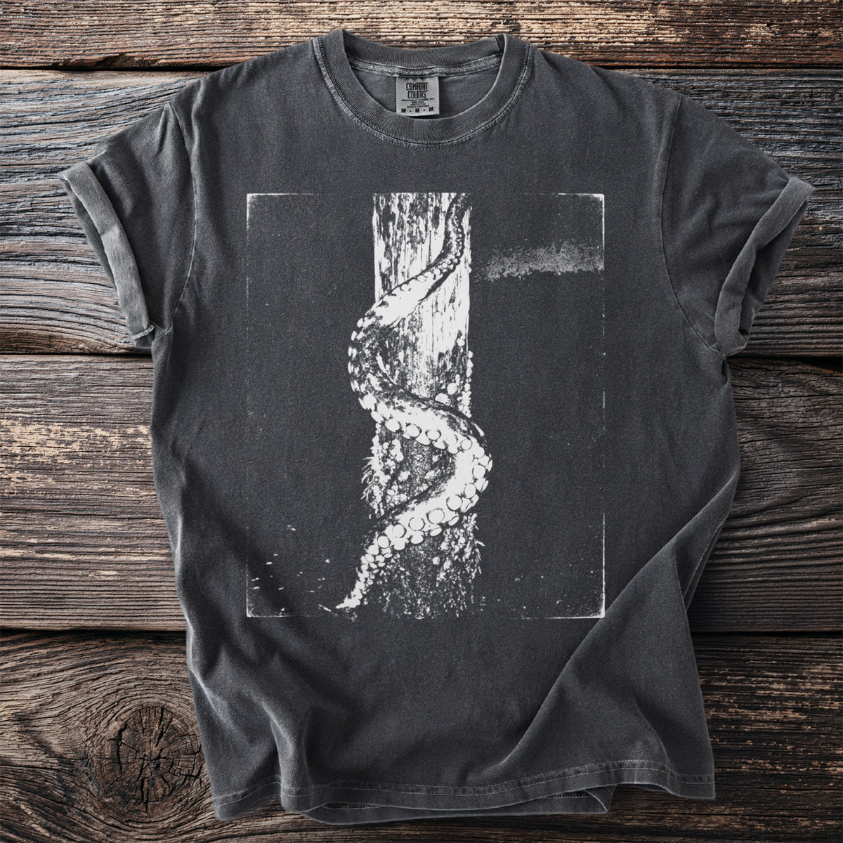 Dark grey t-shirt with a white illustration of a tentacle wrapped around a wooden post.