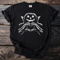 Black t-shirt with a white graphic of a jack-o'-lantern making a heart shape