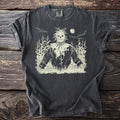 Dark gray t-shirt with a cream scarecrow graphic in a cornfield at night.