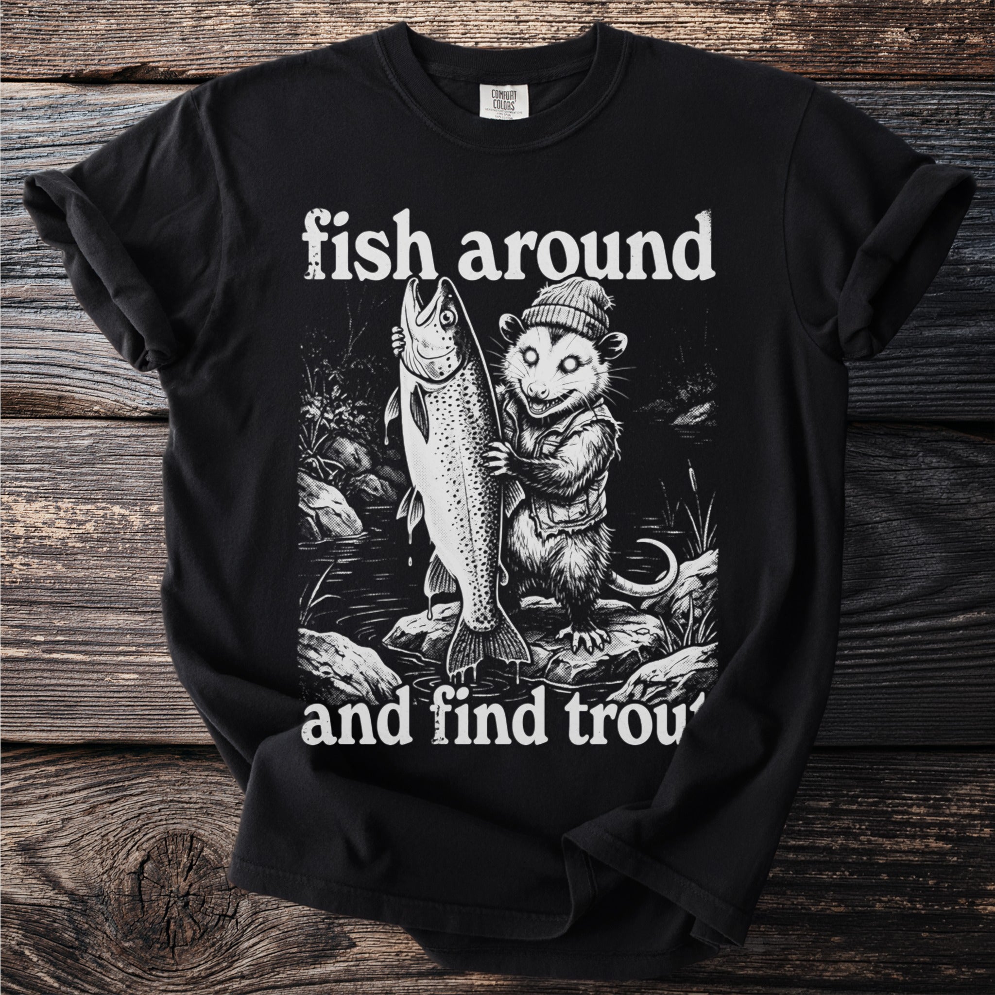 Opossum in vest and hat holds large fish with text "fish around and find trou".