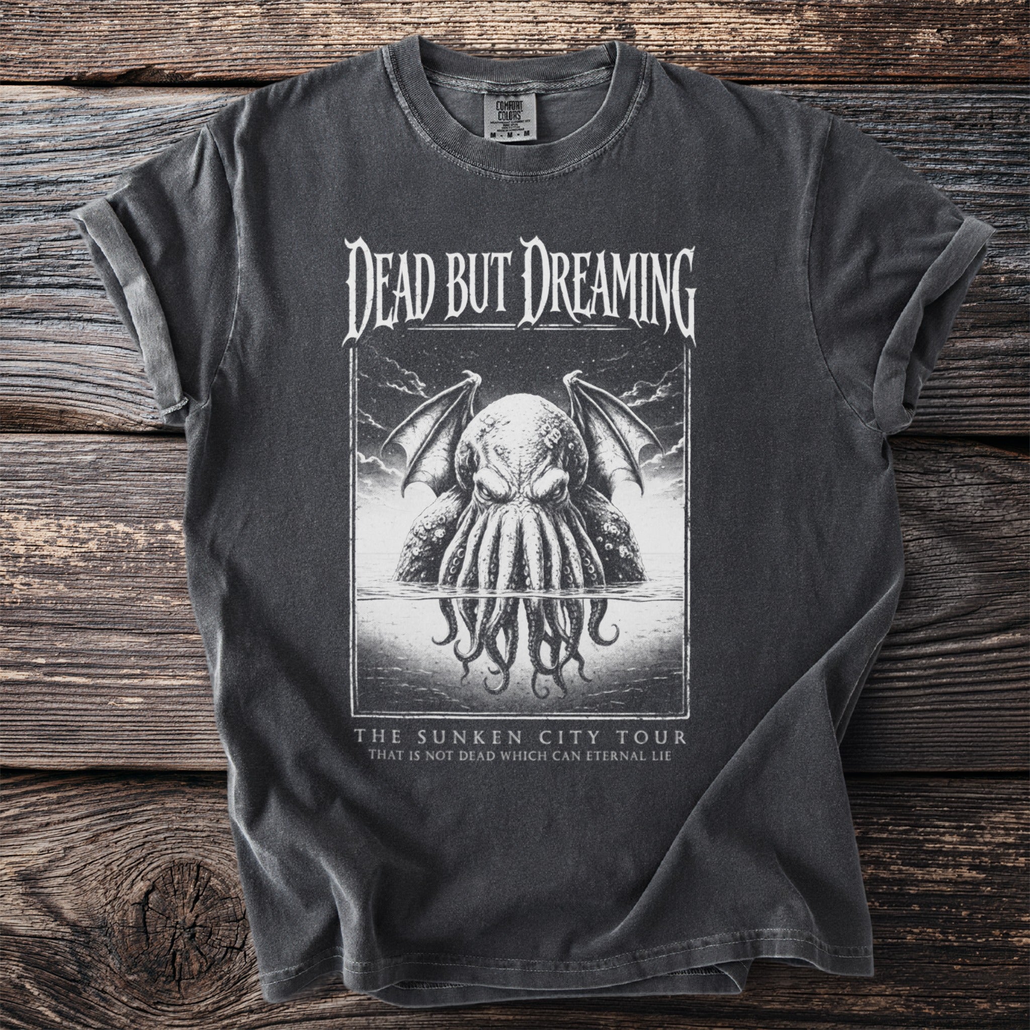 T-shirt with a kraken design and text "Dead But Dreaming The Sunken City Tour".