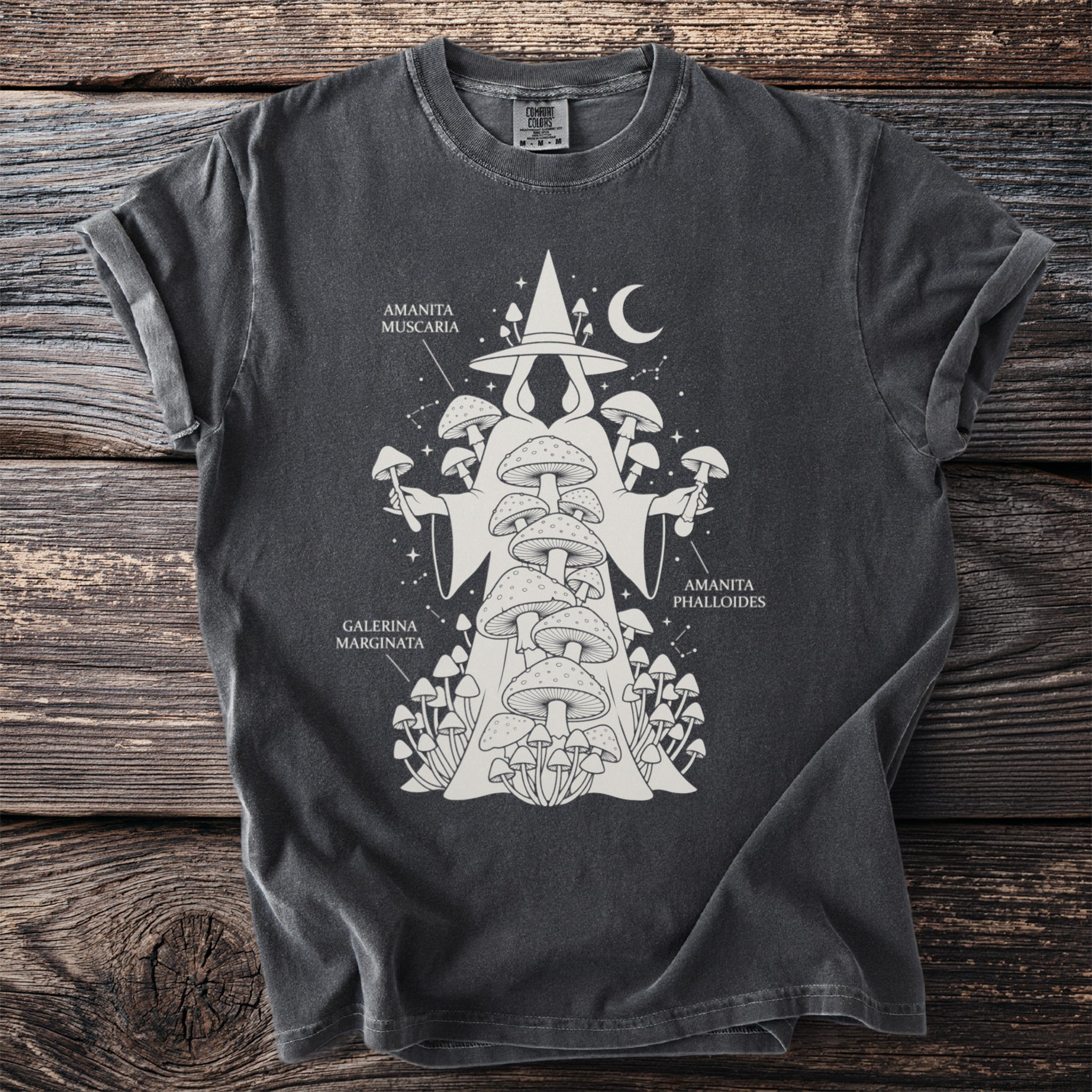 Dark crew neck t-shirt with a white graphic of a robed figure holding mushrooms and text labels.