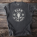 Dark grey t-shirt with a white circular graphic of a figure, deer, and celestial elements.