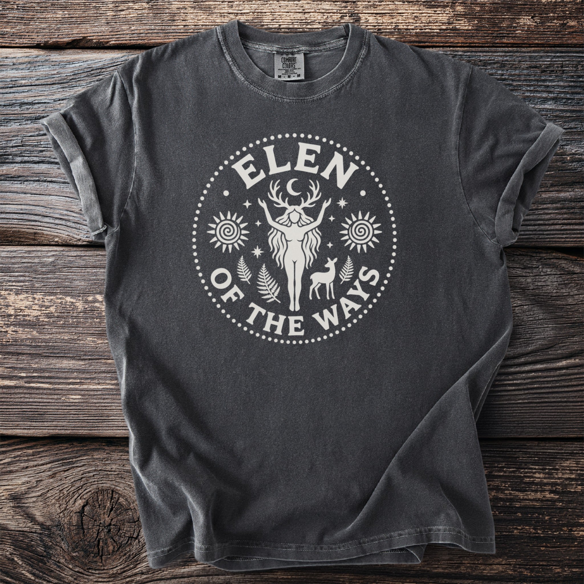 Dark grey t-shirt with a white circular graphic of a figure, deer, and celestial elements.