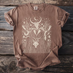 Brown t-shirt with a white graphic of a horned figure, snakes, and a fox.