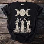 Black t-shirt with a triple moon and three women with upraised arms.