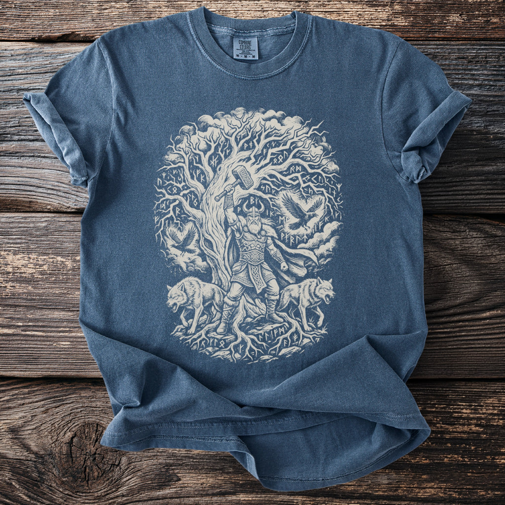 T-shirt with Nordic god, wolves, ravens, and runes beneath a tree.