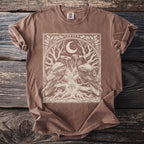 Brown t-shirt with a graphic of two ravens, a tree with an eye, moon, and runes.