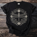 Black t-shirt with a detailed dragonfly and floral wreath illustration.