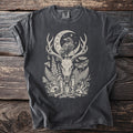 Dark gray t-shirt with a vintage occult graphic featuring a raven, deer skull, moon, and botanicals.