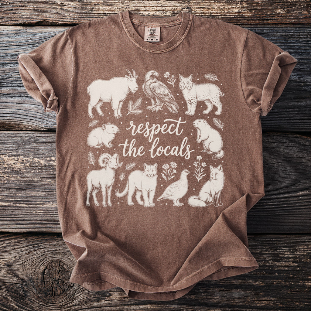 Brown t-shirt with white line art of animals and text "respect the locals".