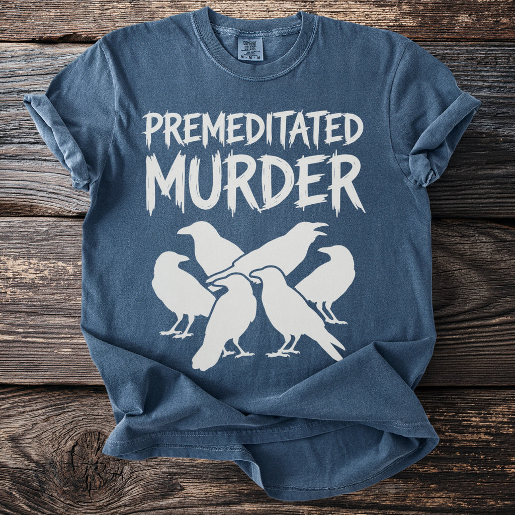 Blue t-shirt with white text "Premeditated Murder" and a group of crows.