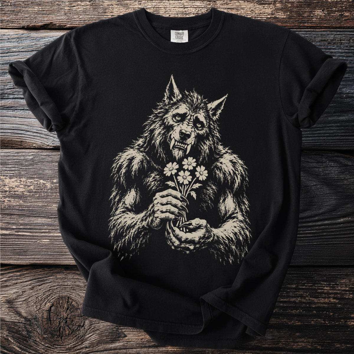 Black t-shirt with a distressed graphic of a werewolf holding a bouquet of daisies.