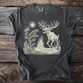 Dark grey t-shirt with cream linocut design of a raven and skeletal elk by a campfire.