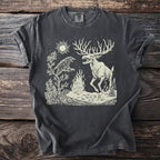 Dark grey t-shirt with cream linocut design of a raven and skeletal elk by a campfire.
