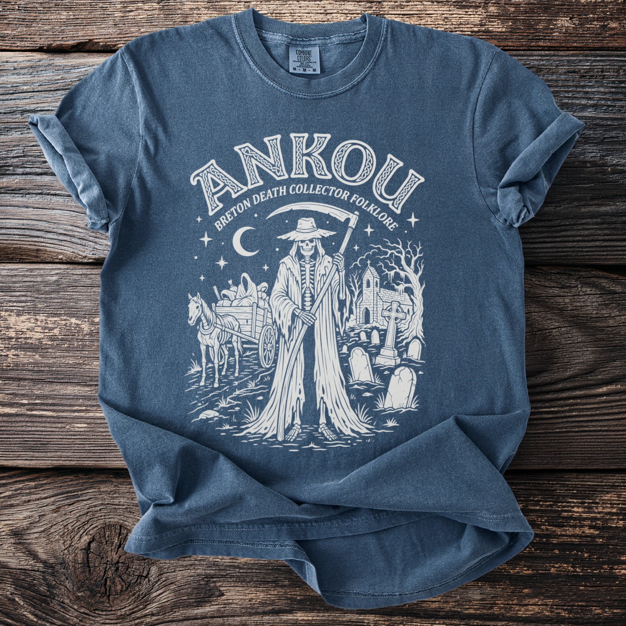 Blue shirt with white "Ankou Breton Death Collector Folklore" graphic and grim reaper scene.