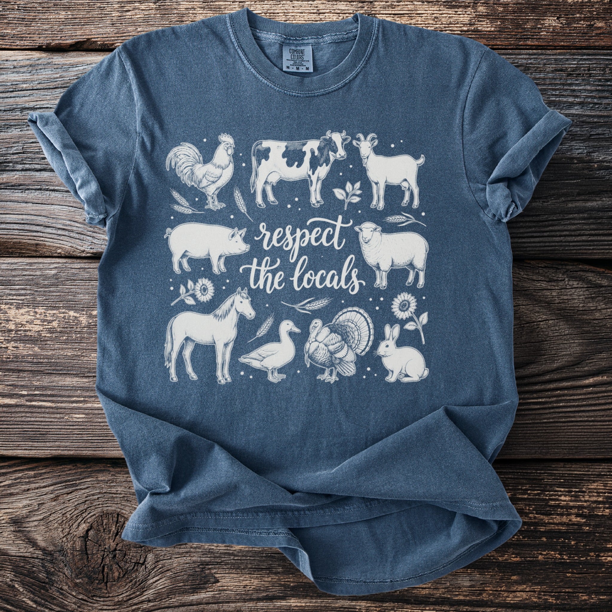 T-shirt graphic with farm animals and "respect the locals" text.