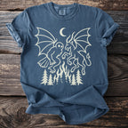 Dark blue t-shirt with cream graphic of owl and demon battling over flames and trees.