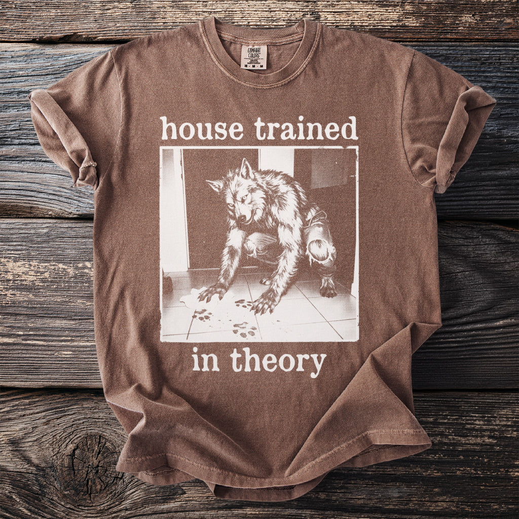 Brown t-shirt with a werewolf image and text "house trained in theory".