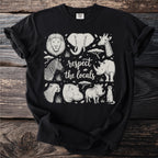 Black t-shirt with lion, elephant, giraffe, zebra, and rhino designs and text.