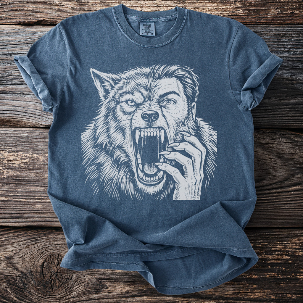 T-shirt with a white illustration of a roaring werewolf's head and a human hand.