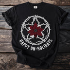 Black t-shirt with barbed wire pentagram and poinsettia, reading "Happy Un-Holidays".