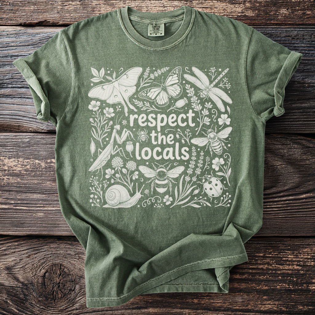 Green t-shirt with white 'respect the locals' text and illustrations of various insects and flora.