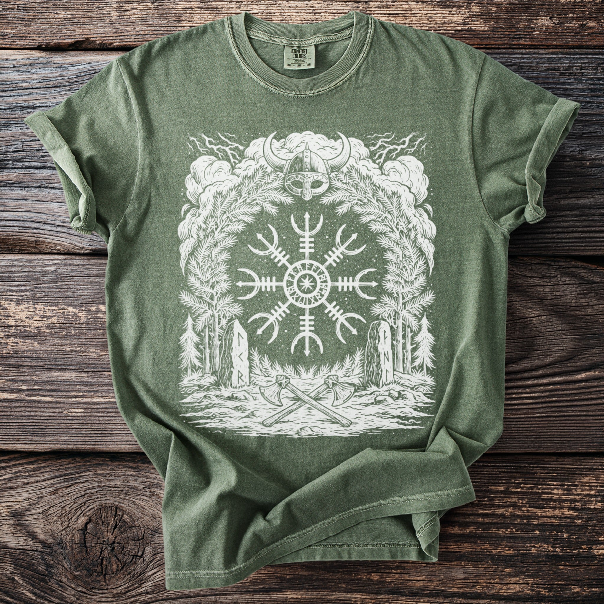 Green t-shirt with white graphic of Viking helmet, compass, trees, and axes.