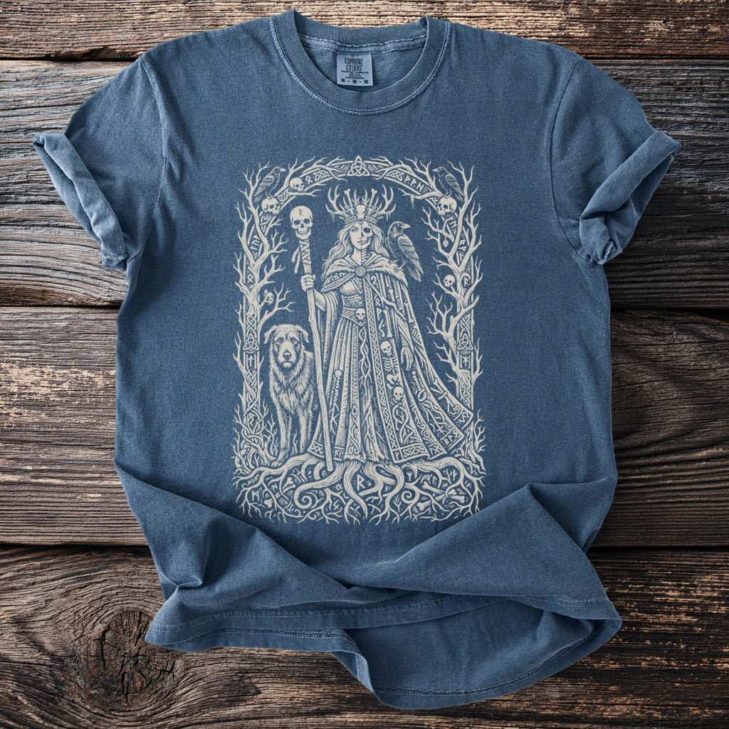 Blue t-shirt featuring a central intricate Norse-inspired graphic of a queen with a dog, raven, and skulls.