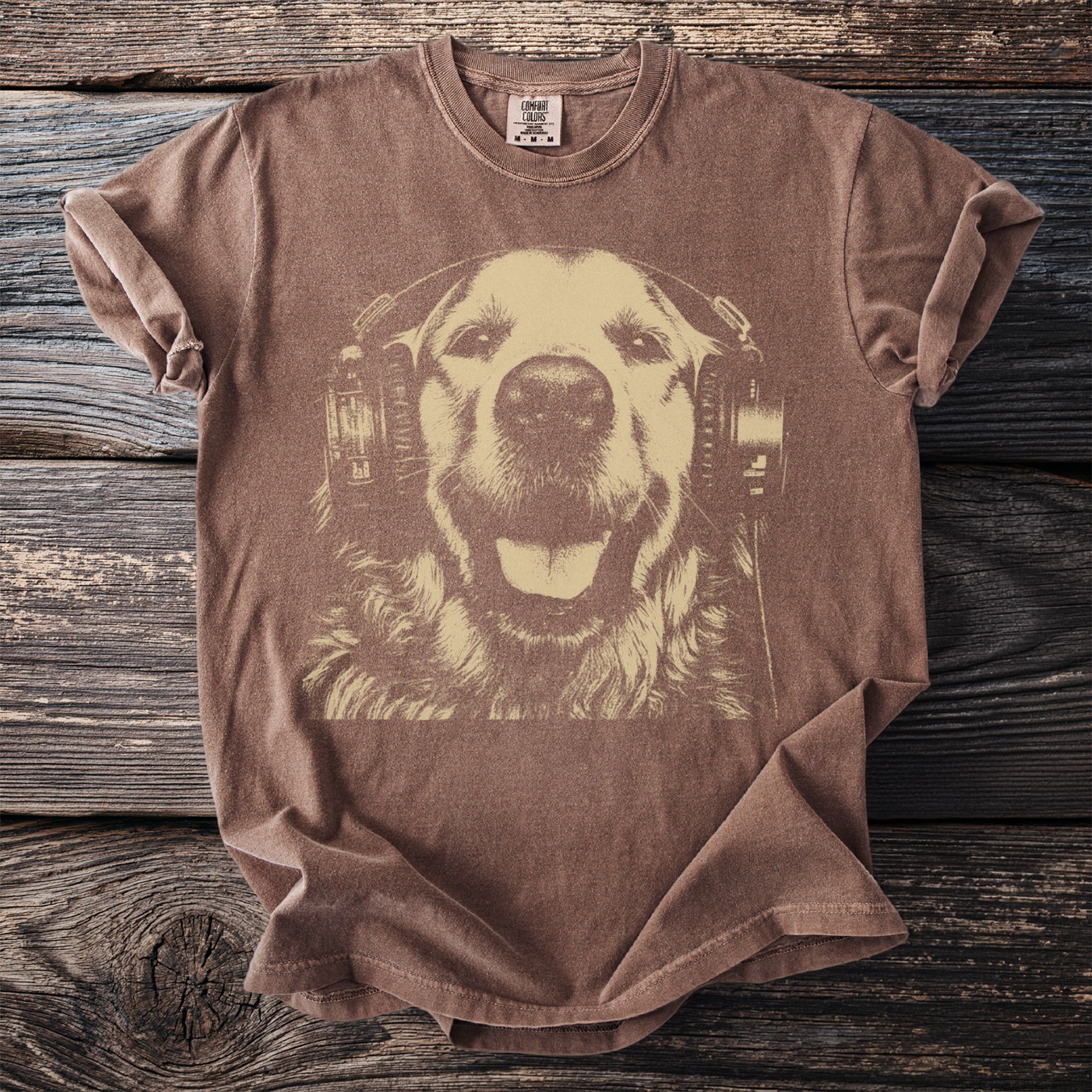 Brown t-shirt with a distressed graphic of a happy dog wearing headphones.
