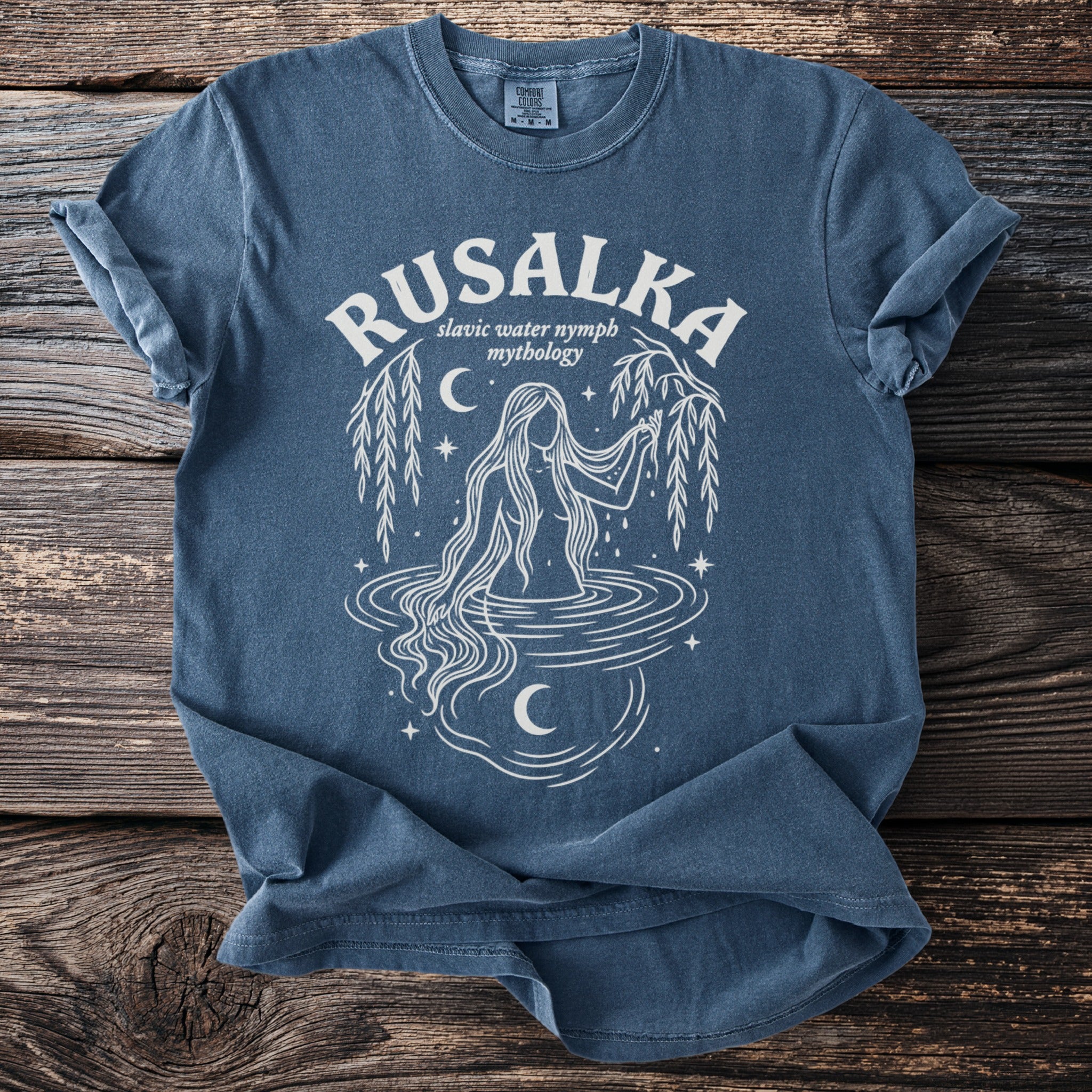 Rusalka Slavic water nymph mythology graphic on a blue t-shirt.