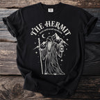 Black t-shirt with white line art of "The Hermit" tarot card, holding a lantern and staff.