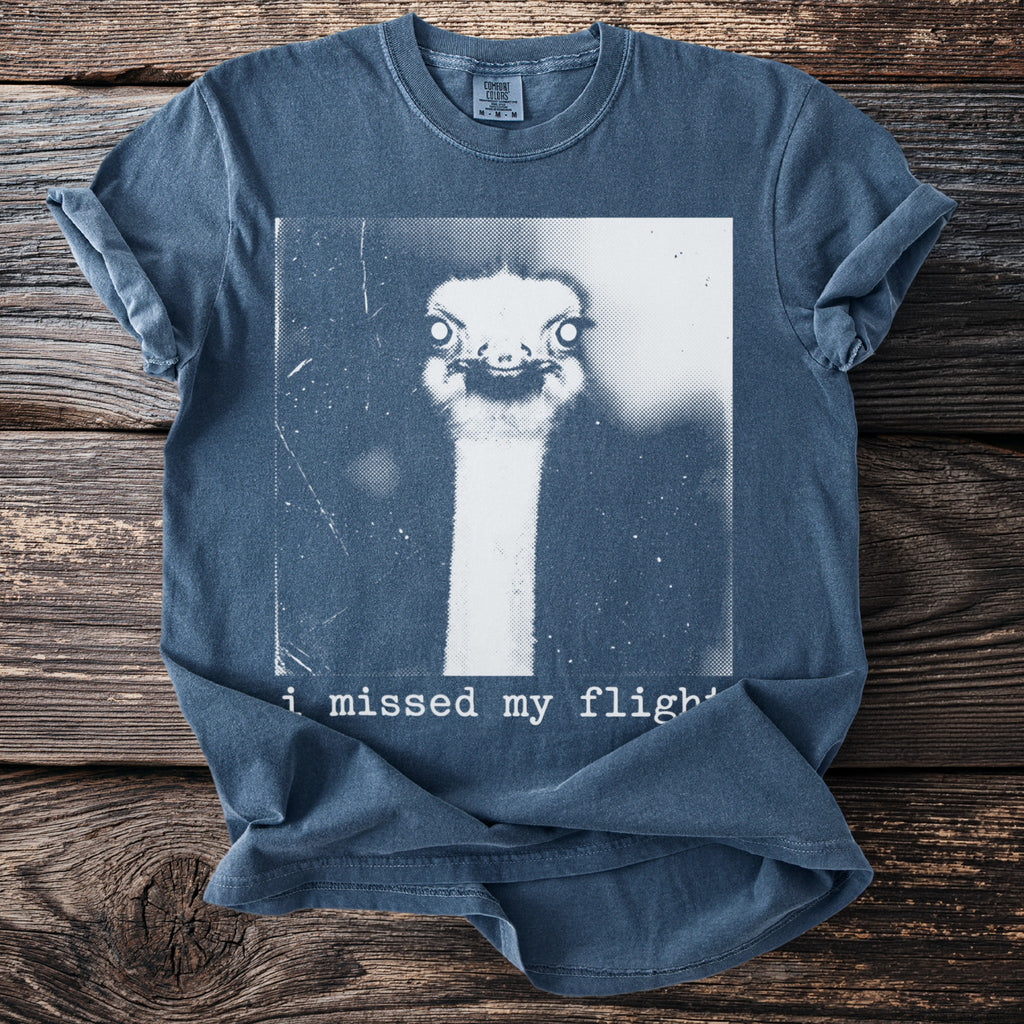 Blue t-shirt with ostrich graphic and text "i missed my flight"