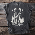Dark grey t-shirt with "Leshy slavic forest god folklore" graphic.