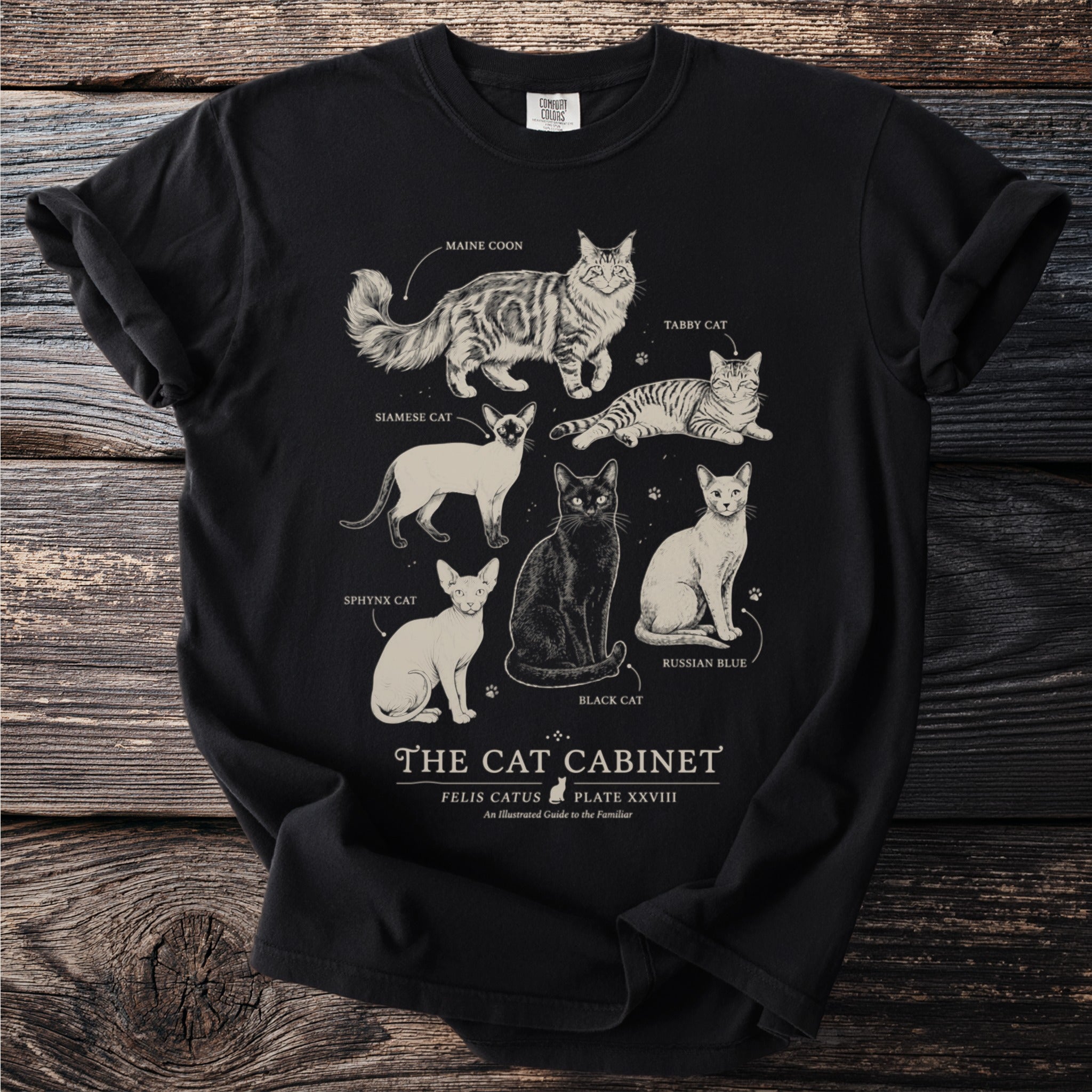 Black t-shirt with "The Cat Cabinet" illustration featuring six cat breeds.