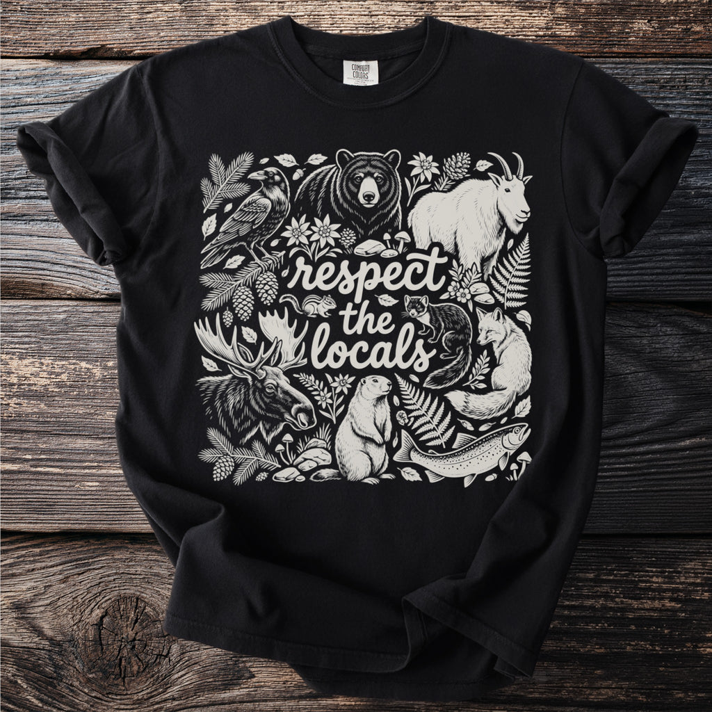 Black t-shirt with "respect the locals" text surrounded by woodland animals and plants.