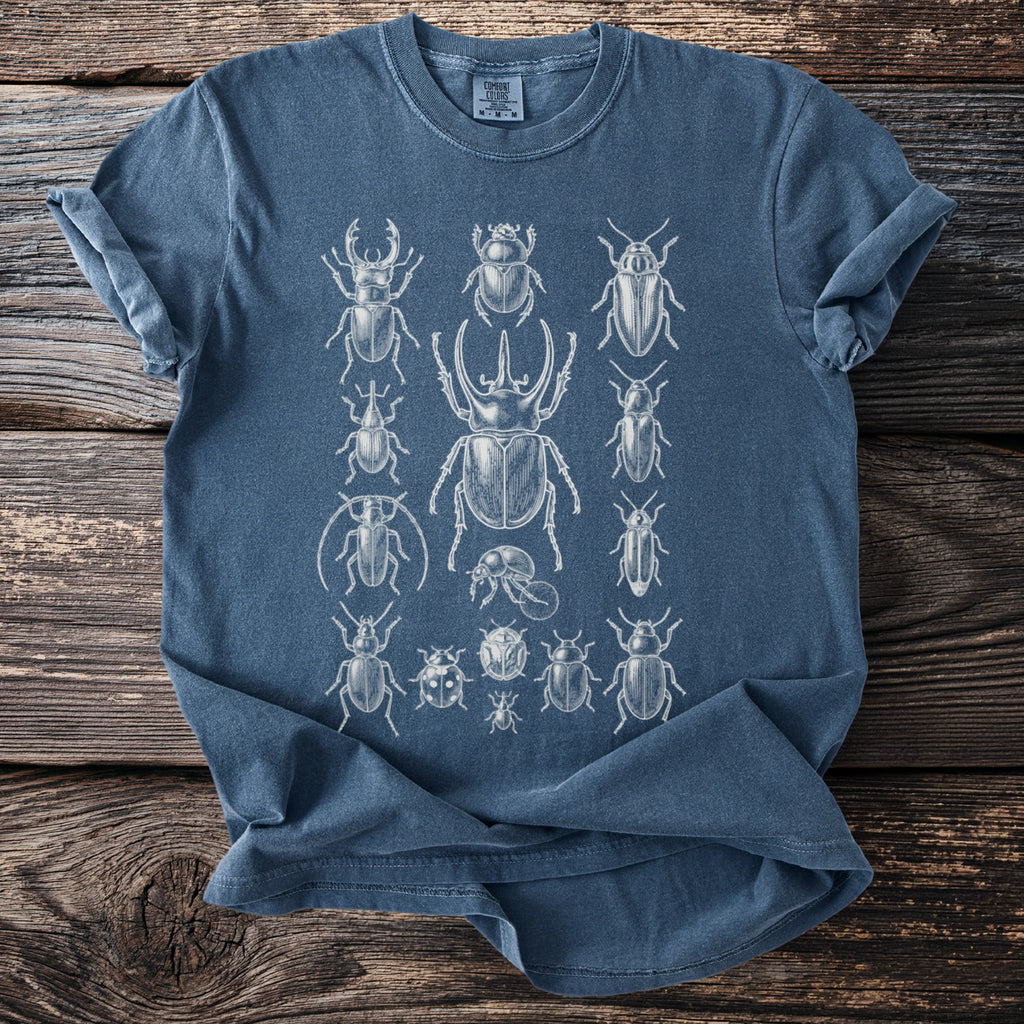 Blue t-shirt with white vintage-style illustrations of various insects across the chest.