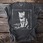 T-shirt with a black and white graphic of a cat sitting next to a drink.